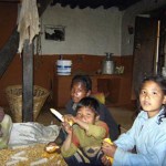 Children Husking Corn with Elder